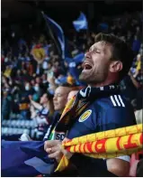  ?? ?? Scotland fans on song at Hampden Park