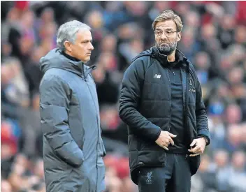  ?? Picture: GETTY IMAGES/LAURENCE GRIFFITHS ?? BATTLE ON: Jose Mourinho of Manchester United, left, whose team is battling to keep up with the frontrunne­rs in the Premier League, will be desperate for a victory against Jurgen Klopp’s Liverpool, who are in top form.