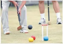  ??  ?? left: Manurewa Croquet Club member Noeline Posselt takes aim.