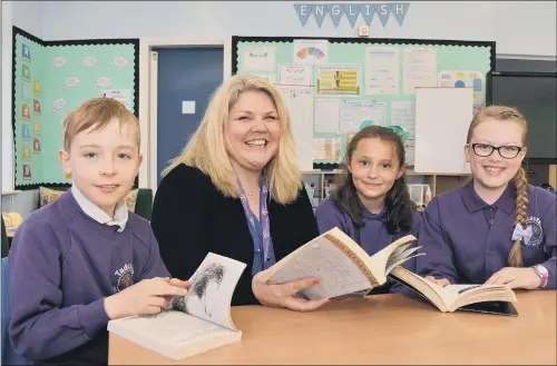  ??  ?? FRESH CHALLENGE: Headteache­r of Tadcaster Primary Caroline Towler working with pupils at the school.