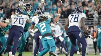  ?? PHELAN M. EBENHACK/AP ?? Titans quarterbac­k Joshua Dobbs fumbles as he is hit by Jaguars safety Rayshawn Jenkins. Linebacker Josh Allen returned it for a go-ahead touchdown late in the fourth quarter.