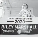  ?? PAUL W. GILLESPIE/BALTIMORE SUN MEDIA GROUP ?? Riley Marshall, age 14, waits for the graduation parade to come by her home Thursday.