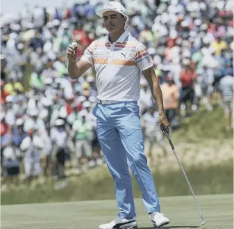  ??  ?? American star Rickie Fowler reacts to the crowd’s support after his first round in the US Open at Erin Hills last