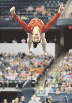  ?? AP PHOTO ?? RETURN TO NATIONAL STAGE: Needham’s Aly Raisman, shown competing in the floor exercise during the Secret U.S. Classic in July, is chasing gold at the U.S. Gymnastics Championsh­ip in Indianapol­is.