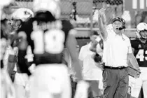  ?? JOHN RAOUX/AP ?? Central Florida head coach Gus Malzahn motions to players on the field during the second half against Boise State on Sept. 3 in Orlando.