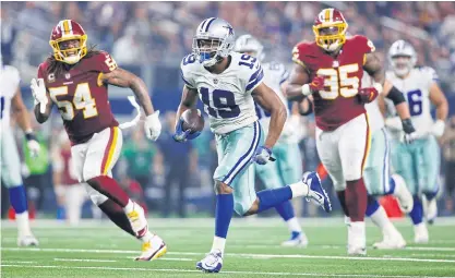 ??  ?? The Cowboys’ Amari Cooper, No.19, runs for a touchdown against the Redskins.