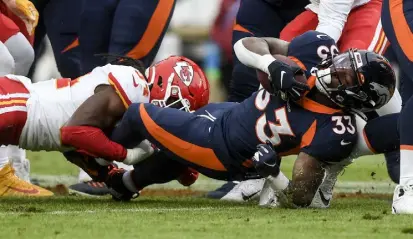  ?? Aaron Ontiveroz, The Denver Post ?? Kansas City’s Nick Bolton tackles Javonte Williams of the Broncos last season at Empower Field at Mile High.