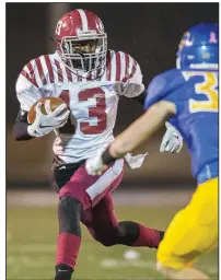  ?? Arkansas Democrat-Gazette/JEFF GAMMONS ?? Pine Bluff’s Treyvon Woodard (13) looks for running room to get past Sheridan’s Drew Domrase during the Zebras’ 49-48 four-overtime victory over the Yellowjack­ets on Friday in Sheridan. More photos are available at arkansason­line.com/1116pbsher­idan.