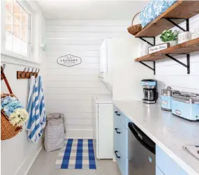  ??  ?? |RIGHT| DUAL PURPOSE. The coastal-meets-farmhouse style laundry room also serves as a kitchenett­e on the guest floor and allows visitors to get their own coffee and snacks in the mornings and evenings. It is located just inside the doors leading to the dock, so it’s also easy to throw damp beach towels into the dryer. “This is a room that my husband and I completed ourselves as a DIY,” Janice says. “I thought it would be a fun project, and it also helped us reallocate some of our budget to other areas that were more important to have profession­ally done.”