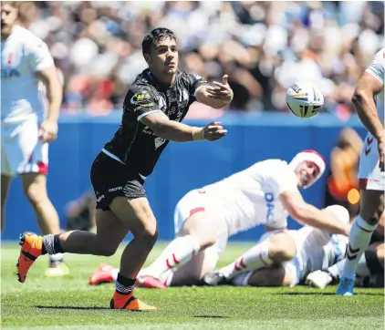  ?? PHOTO: GETTY IMAGES ?? Spin out . . . Kodi Nikorima, of New Zealand, fires out a pass during the Kiwis’ test against England at Mile High Stadium in Denver, Colorado, yesterday.