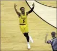  ?? CHUCK BURTON — ASSOCIATED PRESS ?? UMBC’s Jourdan Grant celebrates after a basket against Virginia on March 16 in Charlotte, N.C.