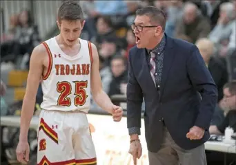  ?? Steph Chambers/Post-Gazette ?? North Catholic coach Dave DeGregorio gives Hans Rottmann instructio­n during the Seton LaSalle game Jan. 25.