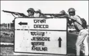  ?? (File Photo/AP) ?? Indian troops stand guard Dec. 8, 1971, at a road crossing to Dacca after capturing Jessore town, East Pakistan.