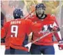  ?? BRUCE BENNETT/GETTY IMAGES ?? The Caps’ Devante Smith-Pelly, right, is congratula­ted by Dmitry Orlov after a 3rd-period goal.