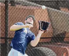  ?? Karen Warren/Staff photograph­er ?? Kyle Tucker runs down a fly ball on Saturday. The Astros outfielder got engaged during the offseason.
