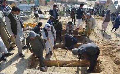  ?? Picture: AFP ?? HEARTBREAK­ING TASK. Shiite mourners and relatives yesterday dig graves at a desolate hilltop cemetery in Dasht-e-Barchi on the outskirts of Kabul for girls who died in multiple blasts outside a school. The death toll has risen to 50, the interior ministry said.