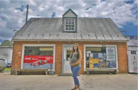  ?? BY RONDA GREGORIO ?? Kendra Settle Hahn, the third generation to help manage the family business, stands outside the deli and grocery off Route 522 in Flint Hill.