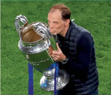  ?? ?? Taste of success... Tuchel kisses the Champions League trophy