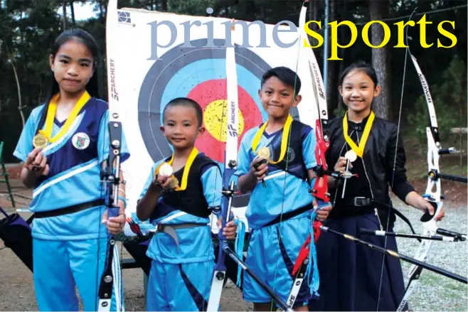  ?? Photo by Roderick Osis ?? YOUNG GUNS. Denny Hanz Binhaon, Darick Faroden, Albert Gambican and Mitz Mae Tabayag display their medal after snatching three gold medals and a silver in the Manila Polo Club Boysen Archery Tournament held during the weekend.