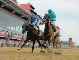  ?? KENNETH K. LAM/STAFF ?? John Velazquez, riding National Treasure, right, won the 2023 Preakness at Pimlico Race Course. A proposal in the Maryland legislatur­e would rebuild the facility at a cost of $400 million.
