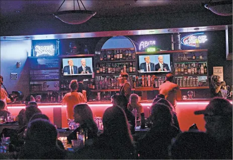  ?? BRIDGET BENNETT/THE NEW YORK TIMES ?? As in 2016, this year’s presidenti­al election features voters who remain undecided with time running out. Above, people attend a debate watch party Sept. 29 in Las Vegas.