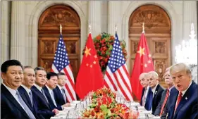  ??  ?? US President Donald Trump, US Secretary of State Mike Pompeo, US President’s National Security Adviser John Bolton and Chinese President Xi Jinping attend a working dinner after the G20 leaders’ summit in Buenos Aires, Argentina, on 1 December.