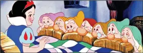  ??  ?? Final cut: Snow White with Dopey, Sneezy and the rest in the 1937 film