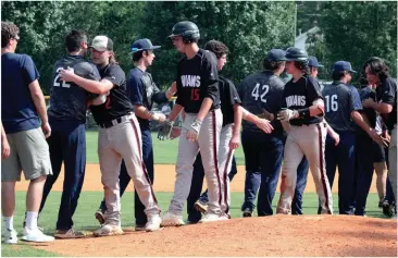  ??  ?? (Left) Senior Kobie Cowan celebrates after the Trojans clinched the final out of the series. (Right) The two rivals take part in a post-game handshake line after a hard-fought three-game series. (Messenger photos/Scott Herpst)