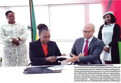  ?? ?? Zimra Commission­er-General Ms Regina Chinamasa (left) and ZIDA chief executive officer Mr Tafadzwa Chinamo exchange documents at the signing ceremony of an MOU for the establishm­ent of a collaborat­ive relationsh­ip between the two organisati­ons. The MOU will enhance ease of doing business and facilitate domestic and foreign investment­s into Zimbabwe. Looking on are Zimra director — legal services Mrs Cynthia Mugwira-Jowa (extreme left) and ZIDA chief legal officer Ms Theresa Muchinguri