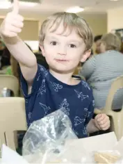  ??  ?? Johnny Thomson is busy eating lollies whilst creating a gingerbrea­d house in Warragul ahead of Christmas.