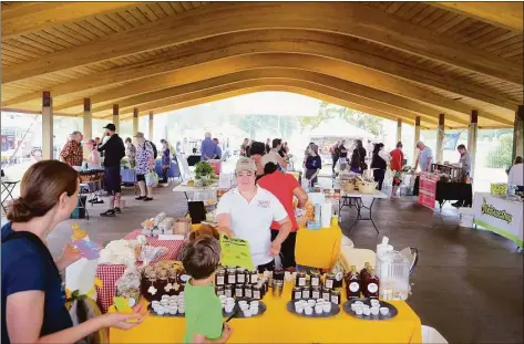  ?? Christian Abraham / Hearst Connecticu­t Media ?? The Walnut Beach Farmers Market starts on June 9 and will continue on Thursdays until Sept. 15 from 4-7 p.m. Pictured is the opening day of the market at the Walnut Beach pavillion in Milford on June 20, 2019.