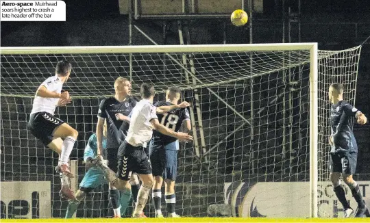  ??  ?? Aero- space Muirhead soars highest to crash a late header off the bar