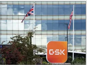  ?? (Bloomberg News WPNS/Chris Ratcliffe) ?? The GSK logo is on a sign outside company headquarte­rs in the Brentford district of London.