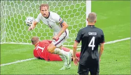  ??  ?? England skipper Harry Kane scores during their Round of 16 match against Germany at Wembley Stadium on Tuesday. All Group of Death teams—Germany, France and Portugal—are eliminated.