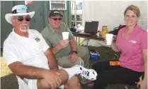  ??  ?? The crew—(from left) Rich Uravitch, Gerry Yarrish, and Debra Cleghorn—take a break during a hot day at Top Gun.