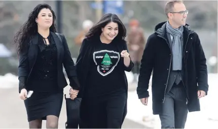  ?? ADRIAN WYLD THE CANADIAN PRESS ?? Peterborou­gh-Kawartha Liberal MP Maryam Monsef, centre, arrives with her sister Mehrangiz and her fiance, Matt DeCourcey.