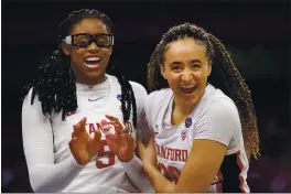  ?? CARMEN MANDATO — GETTY IMAGES ?? Stanford’s Haley Jones (30) and Francesca Belibi (5) celebrate against South Carolina during the fourth quarter in a Final Four semifinal game of the Women’s NCAA Tournament at the Alamodome on Friday in San Antonio.