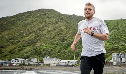  ?? ROSA WOODS/STUFF ?? Harry Cunningham trains on Wellington’s south coast before a 250km foot race across the African desert in April.