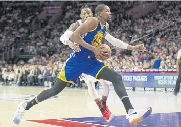  ?? USA TODAY SPORTS ?? Warriors forward Kevin Durant drives against 76ers forward Robert Covington.