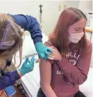  ?? CINCINNATI CHILDREN’S HOSPITAL ?? Katelyn Evans, 16, gets the first of two shots as part of a trial testing Pfizer’s COVID-19 vaccine in minors.