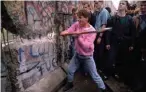  ??  ?? Tearing down the Berlin Wall in 1989