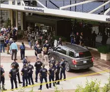  ?? Associated Press ?? Emergency personnel respond to a shooting at the Natalie Medical Building on June 1 in Tulsa, Okla.