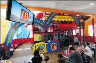  ?? Damian Dovarganes/the Associated Press ?? Patrons watch the new McDonald’s television channel at a McDonald’s restaurant in Norwalk, Calif.