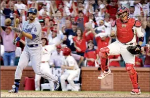  ?? AP/DAVID. J. PHILLIP ?? St. Louis catcher Yadier Molina (right) celebrates after Los Angeles pinchhitte­r Andre Ethier struck out to end Game 2 of the National League Championsh­ip Series at Busch Stadium in St. Louis. Ethier was one of three Dodgers to strike out against the...