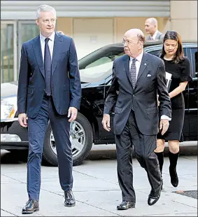  ?? AP/FRANCOIS MORI ?? French Finance Minister Bruno Le Maire (left) welcomes U.S. Secretary of Commerce Wilbur Ross ahead of their Thursday meeting in Paris. Ross said talks with the Europeans about U.S. tariffs on European steel and aluminum were not successful enough to...