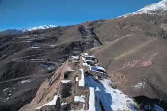  ??  ?? Snow covers the ruins of the Alamut Castle, on a mountain in the Alamut region, Iran.