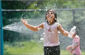  ?? Carol Kaliff / Hearst Connecticu­t Media file photo ?? Elia Backus, 5, cools off at the Highland Avenue Spray Park in Danbury in 2018.
