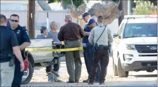  ?? Buy this photo at YumaSun.com PHOTO BY RANDY HOEFT/YUMA SUN ?? RURAL/METRO FIRE DEPARTMENT AND LAW ENFORCEMEN­T personnel tend to an unidentifi­ed couple near the scene of an officer involved shooting Wednesday afternoon in the 2500 block of Augusta Drive.