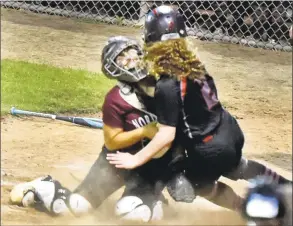  ?? Peter Hvizdak / Hearst Connecticu­t Media ?? North Haven catcher Gigi Russo puts the tag on Cheshire’s Sohpia Vagts during Friday’s SCC championsh­ip game.