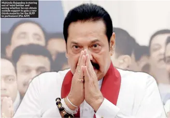  ?? (Pix AFP) ?? Mahinda Rajapaksa is staying out of ‘mini battles’ and seeing whether he can obtain outside support to gain a twothirds majority for the SLPP in parliament